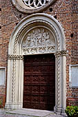 Castiglione Olona -  Lunetta del portale maggiore della Collegiata, (1428). 